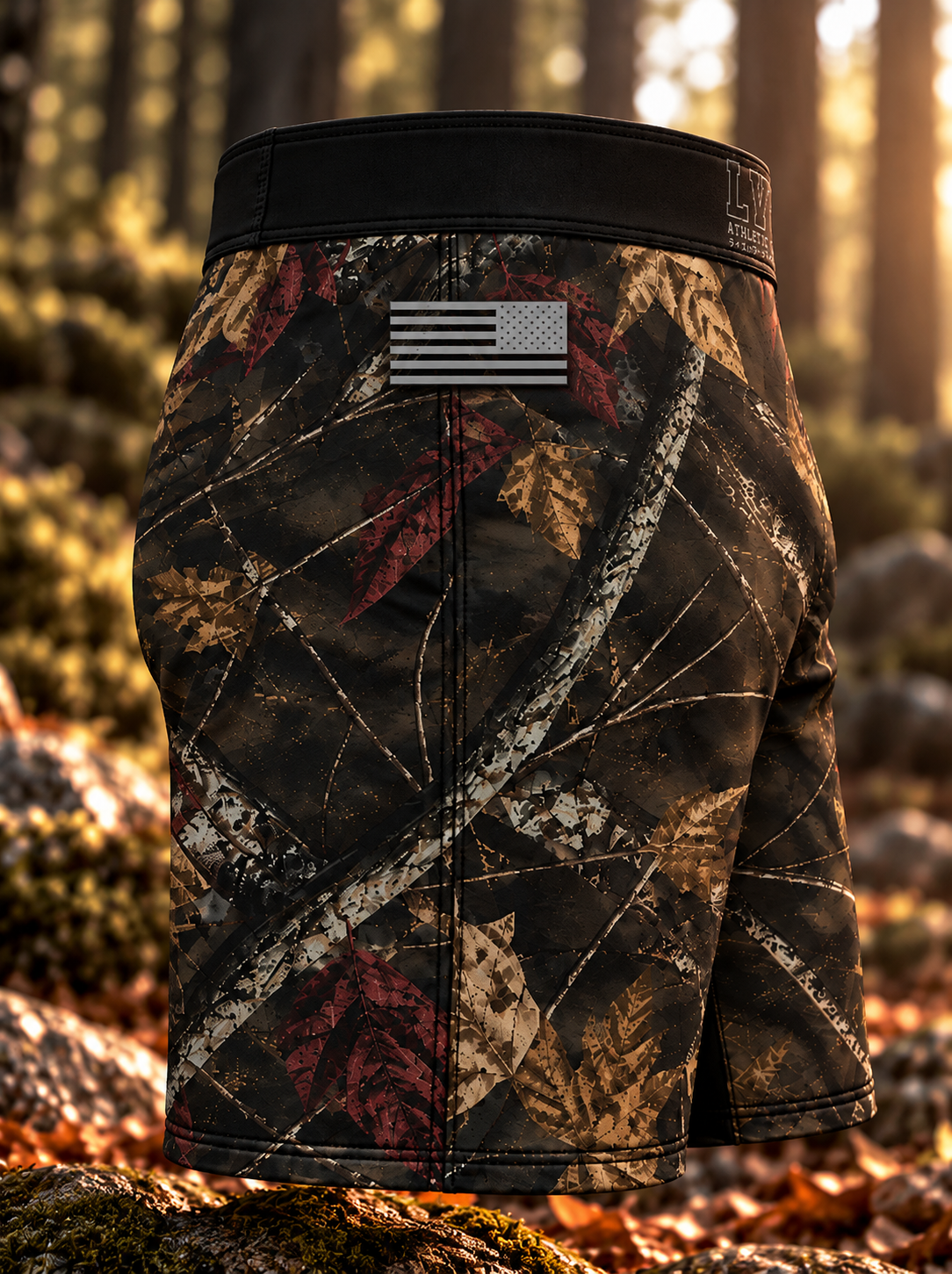 Side view of men's LV8 Woods shorts showing the monochrome American flag, woodland camouflage, and side seam.