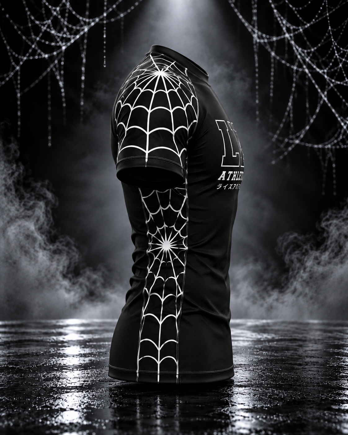 Side view of the men's Spider Web set rashguard showing white web graphics along the sleeve and side panel